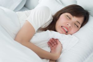 woman stressed sleeping