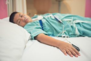 Young boy wearing device for sleep test